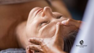 Woman receiving a relaxing fall facial treatment with facial massage at a Bethlehem, PA spa
